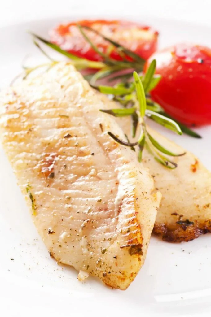 Swai Fish fillet with fresh herbs and tomatoes mage