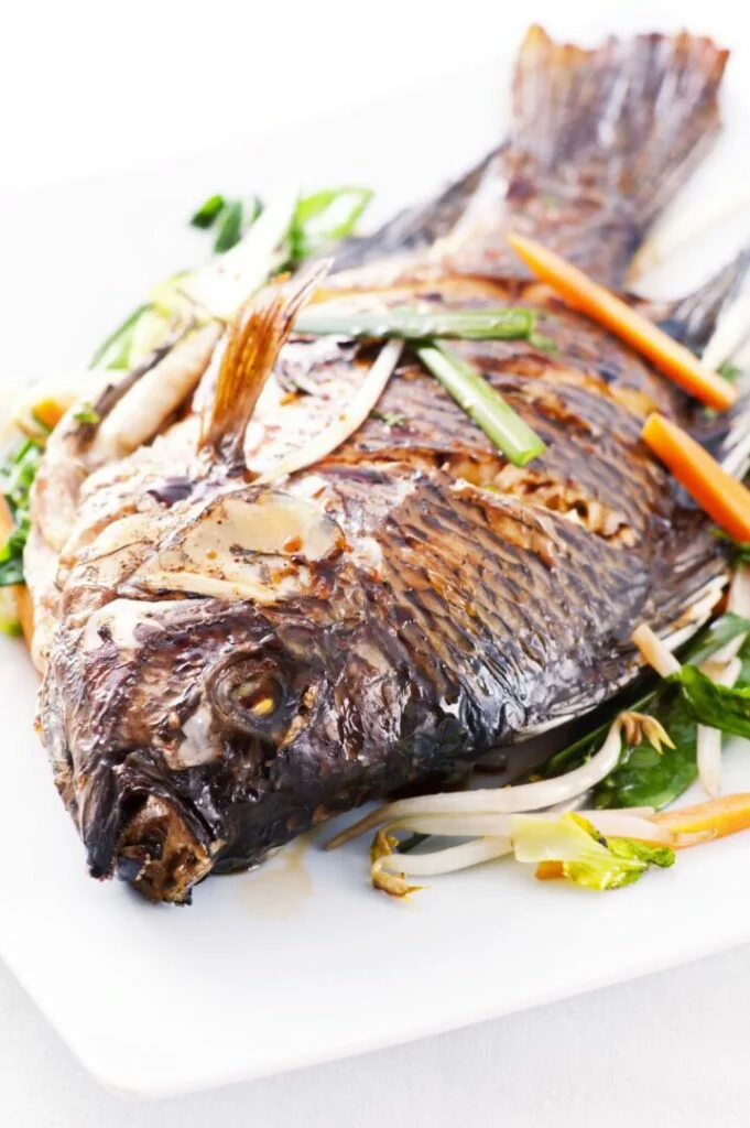 Tilapia fried with vegetables Image