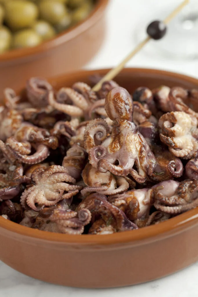 Pickled small baby octopus in a bowl