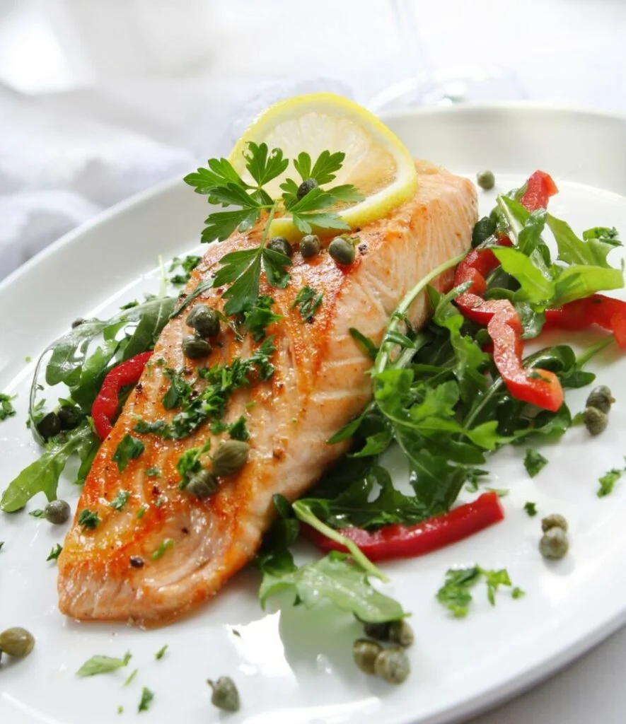 Grilled Atlantic Salmon with a rocket salad, capers and lemon slices