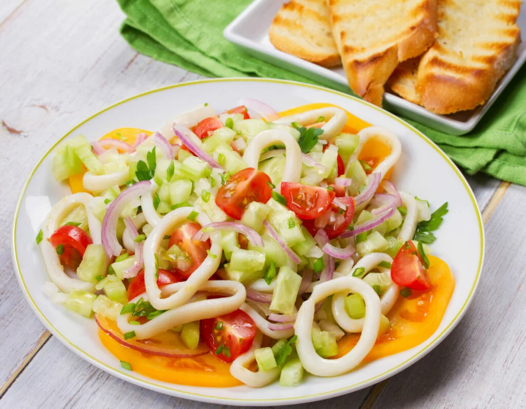 Squid, tomato, onion and greens salad