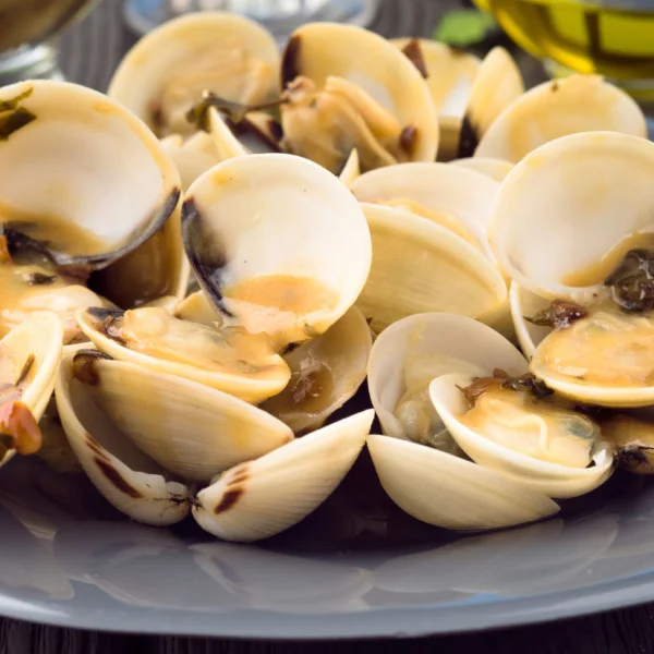 Channel Seafoods International clams cooked on a gray dish